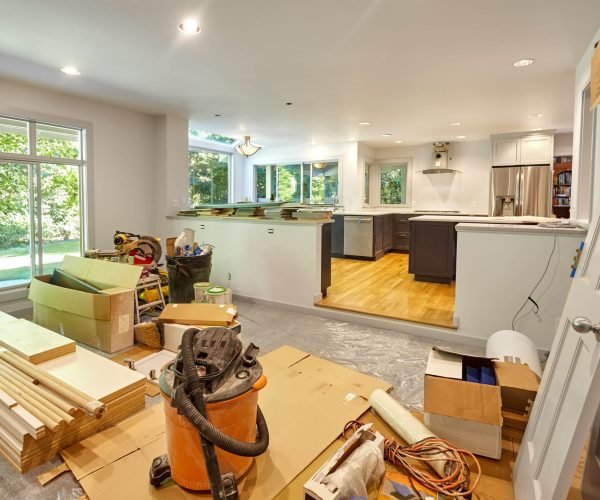 Shelves, circular saw, doors and other remodeling tools and supplies fill the family room as the kitchen is worked on
